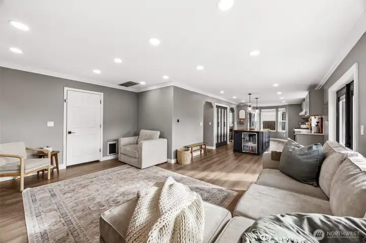 You'll be captivated by the generous family room with crown molding, new luxury vinyl floors, warm designer colors and modern touches.