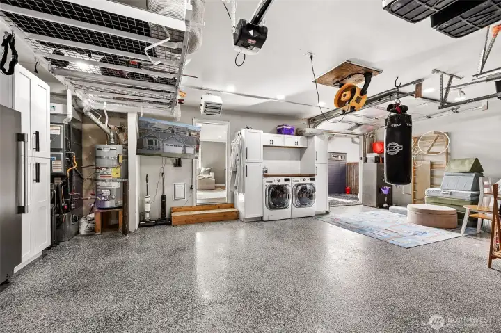 Epoxy floors, storage cabinets, laundry area + a single door garage leading to the backyard. 2 year old Dakine heat pump with new furnace and high end filtration for household Asthma with UV filter and Dakine micron filter.