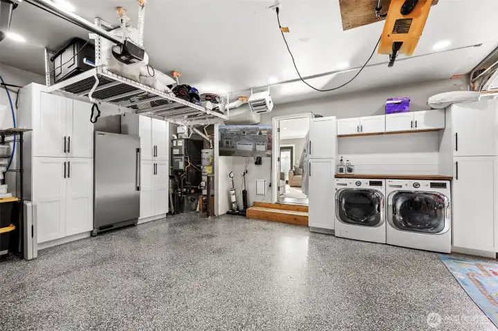 Dream garage with all the storage options! Sellers have truly maximized the space in this home! Home is wired for an EV car charger- the base of this charger will remain with the home.