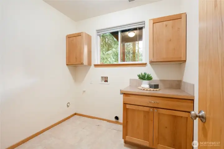 Large utility room just at the bottom of the stairs.