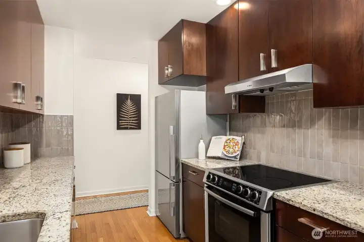 Granite counters and updated tile backsplash.