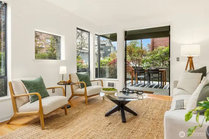 Generous living room with lots of light while maintaining privacy, and French doors that open to the larger of two patios.