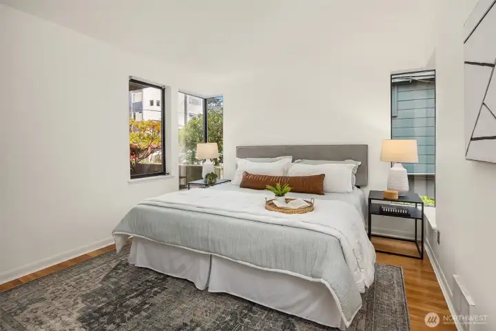 Primary bedroom with walk-in closet and en-suite updated bathroom