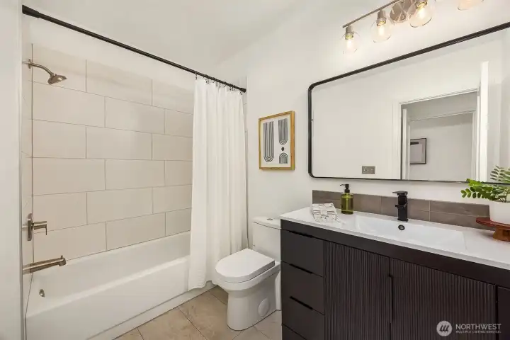 Primary bedroom with walk-in closet and en-suite updated bathroom