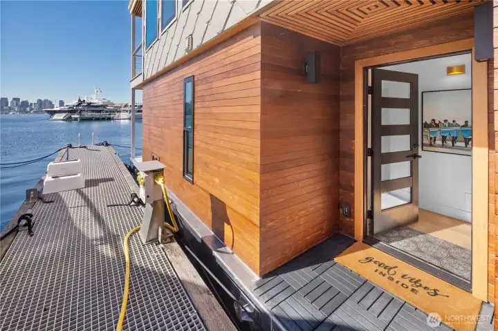 A thoughtfully designed layout features a private primary suite on the main level with a lux bath and sliding doors opening to the deck—perfect for a morning dip, paddle board or coffee and croissant over the water. The entry level includes an additional bedroom & second lux bath, ideal for guests or flexible living.