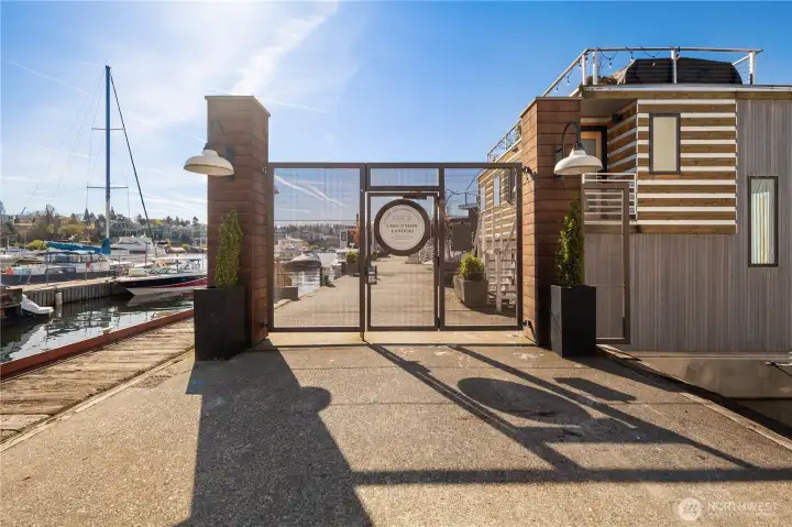 Located within the gated, co-op owned Lake Union Landing community, enjoy a tree-lined dock with benches & rare gated on-site parking.