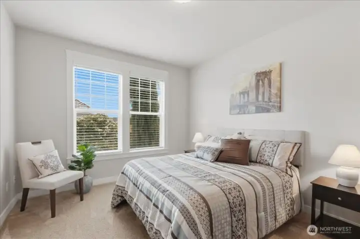 Bedroom 2 with a view of the front yard.