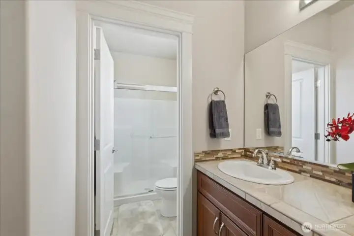 Main bathroom is between bedrooms 2 and 3 and features an oversized shower.