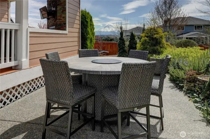 The lower concrete patio with mountain views. All outdoor furniture is negotiable.