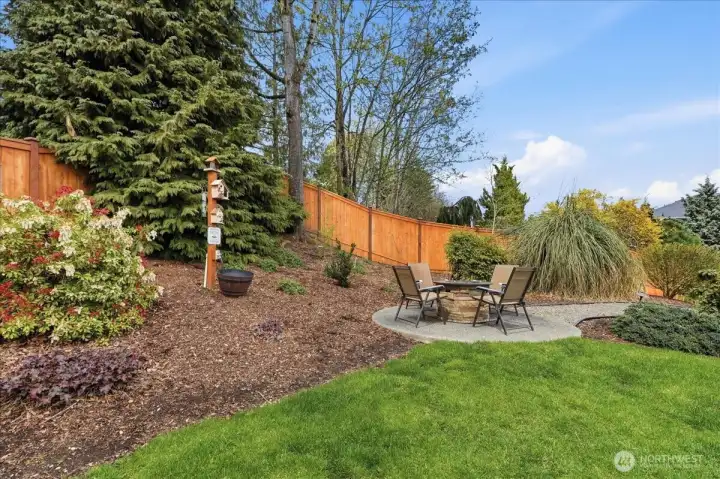 The 2nd concrete patio is the perfect place to enjoy a full mountain view.  This furniture around the firepit stays with the home.