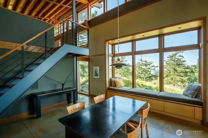 Stairway to loft, dining area