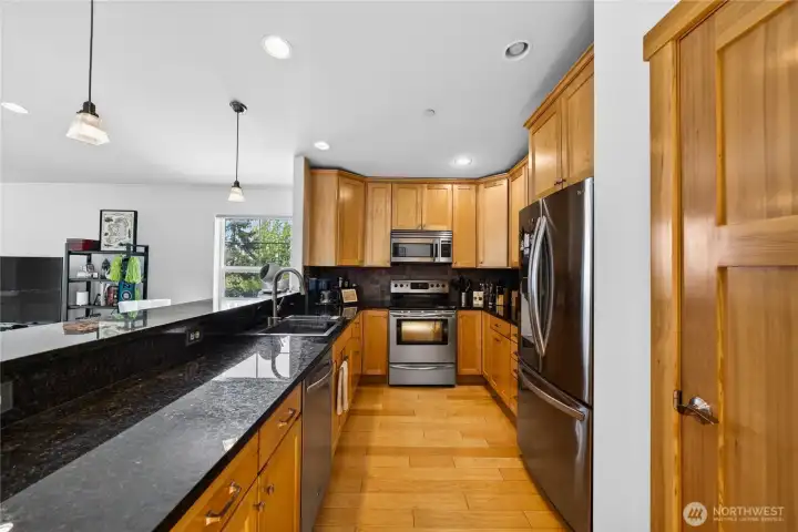 Open kitchen with extensive counter space and storage.
