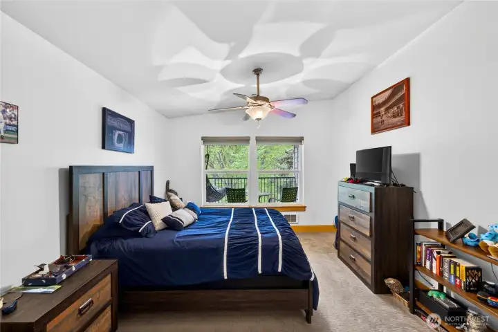 Owner's suite bedroom overlooks the private balcony out to the park grounds.