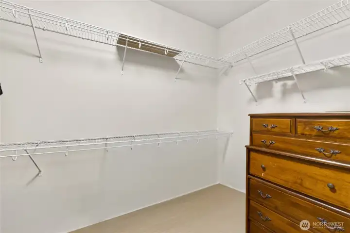 Owner's suite walk-in closet with additional storage space.