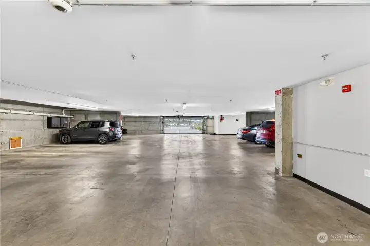 Secure, interior parking garage with assigned parking space and area for additional storage.