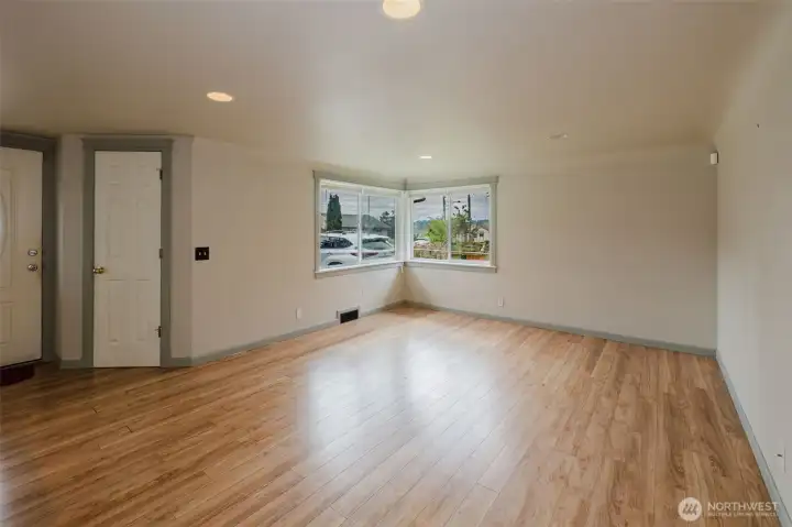 Spacious living room area with open concept to the kitchen.