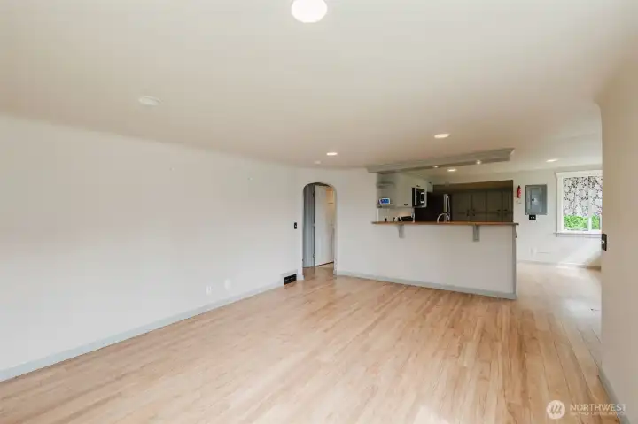 Living room with hallway to 2 upstairs bedrooms and full bath.