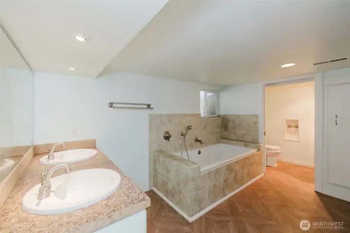 Primary bathroom downstairs, attached to the bedroom as an ensuite.