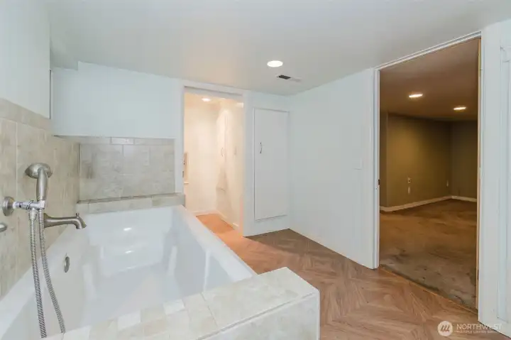 Primary bathroom downstairs, attached to the bedroom as an ensuite.