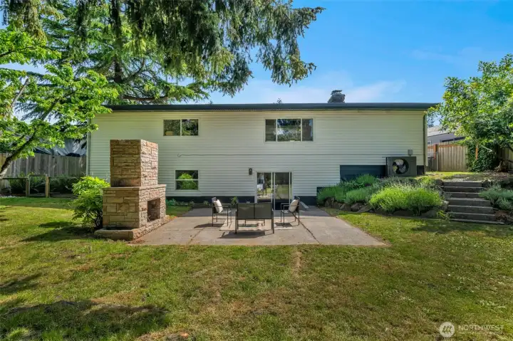 Lovely large back yard with the patio & fireplace. A perfect place to be!