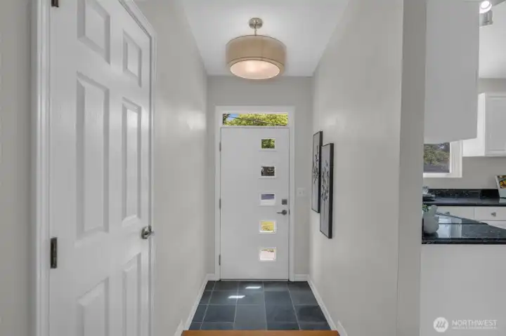 Slate floors & coat closet.