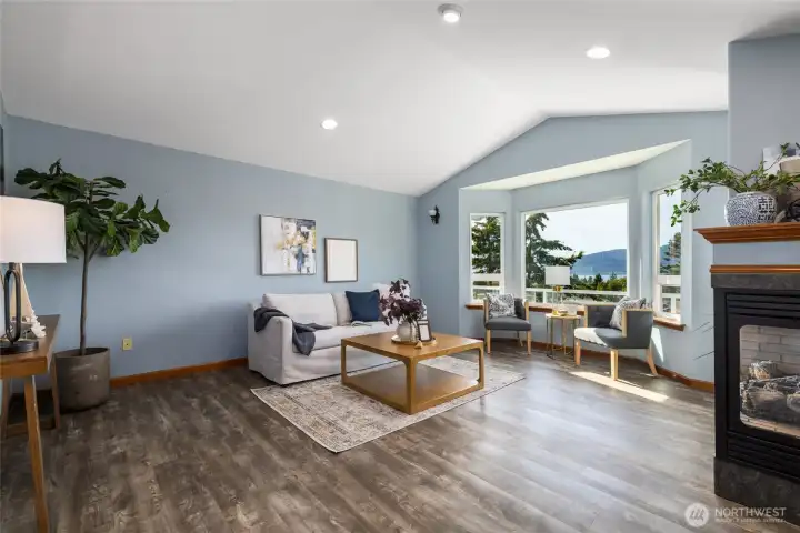 Spacious open living room with views and a double sided fireplace. Spacious open living room with views and a double sided fireplace.