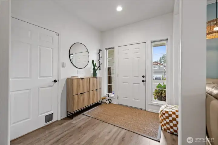Step into a spacious entry featuring luxury vinyl plank flooring and a bright, open feel that welcomes you home.