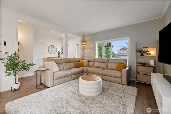 Large windows and an open layout create a bright, airy feel, making the family room one of the home's most inviting gathering spaces.