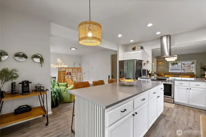 A convenient pass-through bar connects the kitchen and dining room, creating the perfect space for serving meals, entertaining guests, or casual conversation.