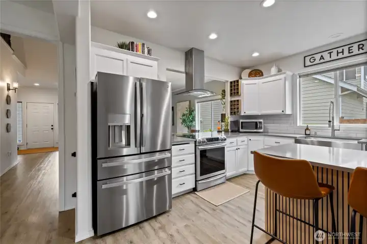 Designed for both everyday living and entertaining, the kitchen opens effortlessly to the dining area and family room, keeping everyone connected.