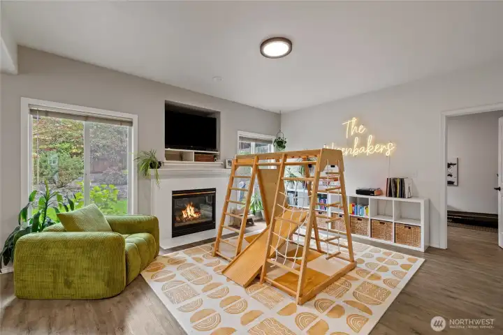 A cozy gas fireplace creates a warm focal point for gatherings with family and friends.