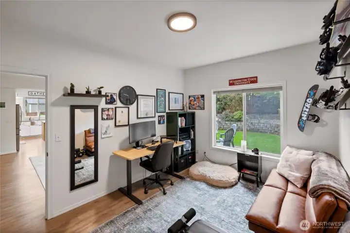 The versatile main-floor bedroom offers exceptional flexibility and can easily serve as a guest room, private home office, hobby space, or multi-generational living area.