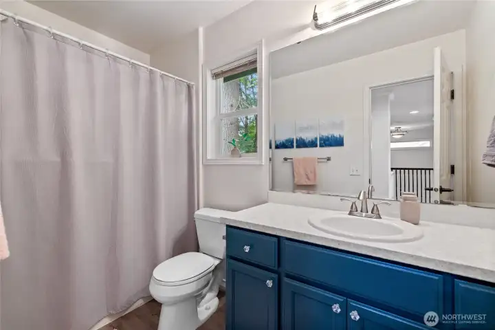 Bright and functional, the second-floor main bathroom offers ample space to accommodate busy mornings and everyday living.