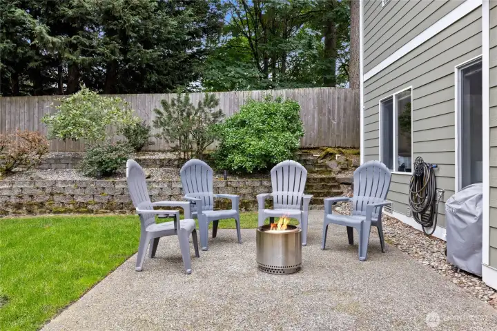 The private backyard offers mature landscaping and peaceful outdoor living spaces.