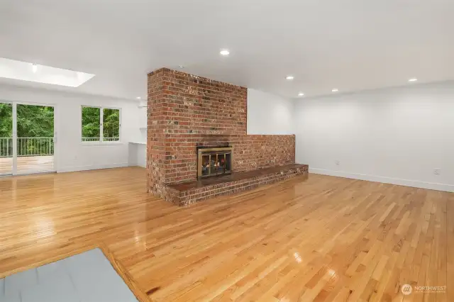 The open flow of the living room to the dining space really allows you to customize your living spaces without the barrier of walls, and allows the airy lightness from the skylight to make quite an impression when entering this home.