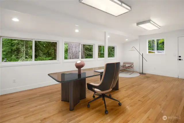 This large room provides the ultimate in flexibility as it can easily be transformed into a dream remote office work zone, deluxe studio-style bedroom, or a busy recreation room, all on the main floor of this amazing home.