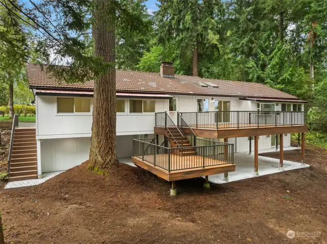 Extra wide stairs lead from the circular driveway down to the lower exterior patio, creating an easy way for private entrance and exit from the lower level. The new Ring alarm professional security system will help keep peace of mind too!