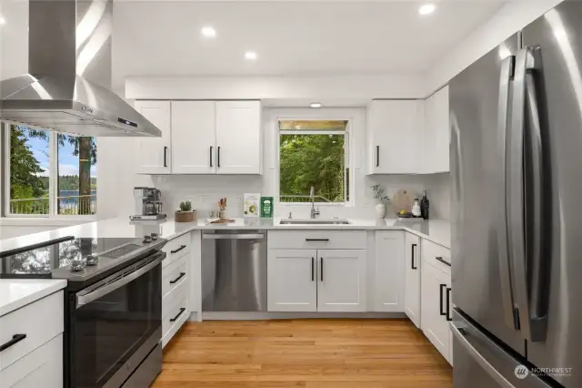 Updated and ready for the chef in your life, the gorgeous suite of stainless appliances all stay with the home, and the classic shaker style cabinets with updated matte black hardware will be serving style for years to come.