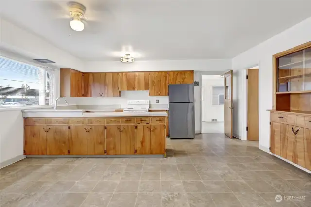 Open layout in house connects living room, dining area, and kitchen