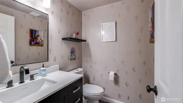 A thoughtfully placed downstairs half bath, designed for ease and accessibility