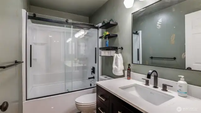 Upstairs bathroom featuring a sleek, modern design with clean lines and stylish finishes