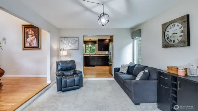 This inviting sitting area is conveniently located just off the entrance, perfect for welcoming guests or relaxing with ease