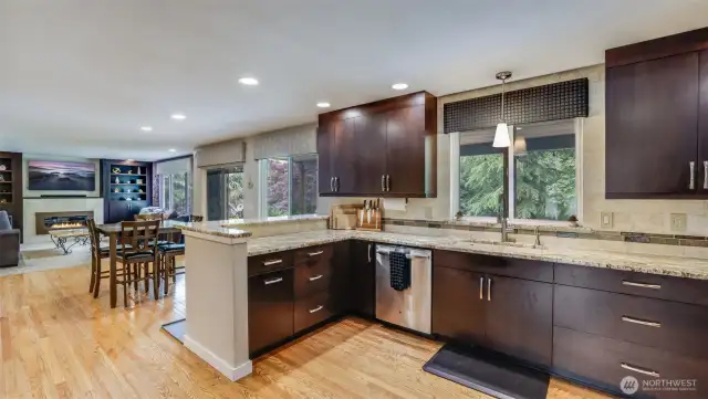 Bathed in natural light, this kitchen flows naturally into the dining area and living room—creating an open, inviting space perfect for cooking, dining, and relaxing together