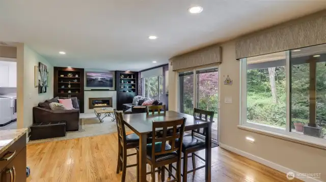 Large windows fill the room with abundant natural light, creating a bright and welcoming atmosphere throughout the day