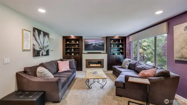 Cozy seating arrangement designed for conversation and comfort, anchored by soft textiles and tasteful accents!