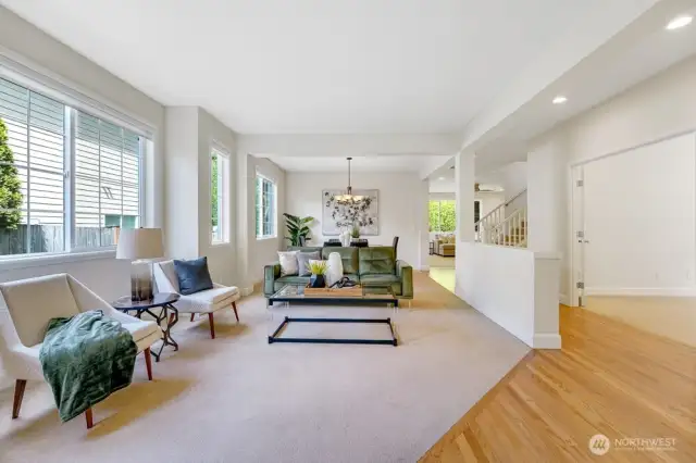 Large, open entry with Oak hardwood floors.