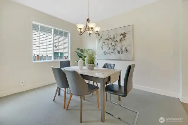 Formal dining room gets tons of natural light. The floor plan flows well from formal living to dining to family room and kitchen.