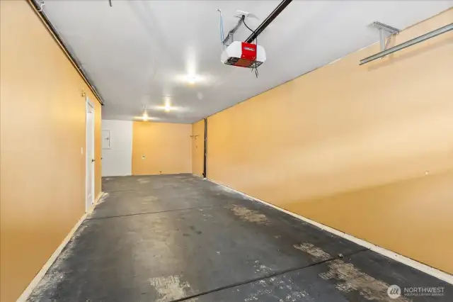 Tandem garage with extra storage/work space.