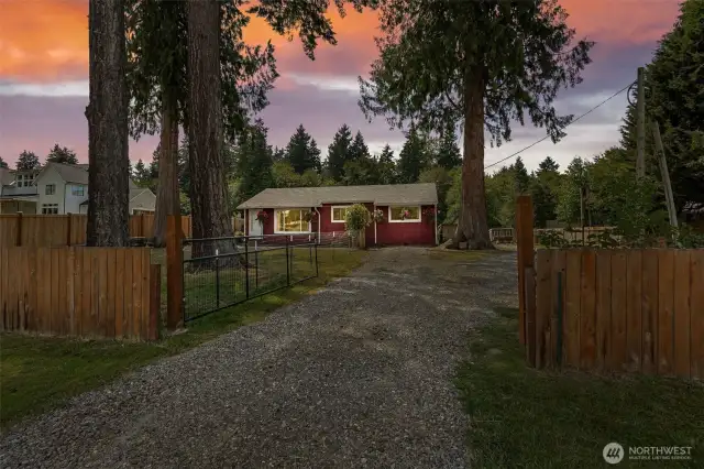 Welcome to 12204 Woodland Ave E. The cutest little red house you ever did see.
