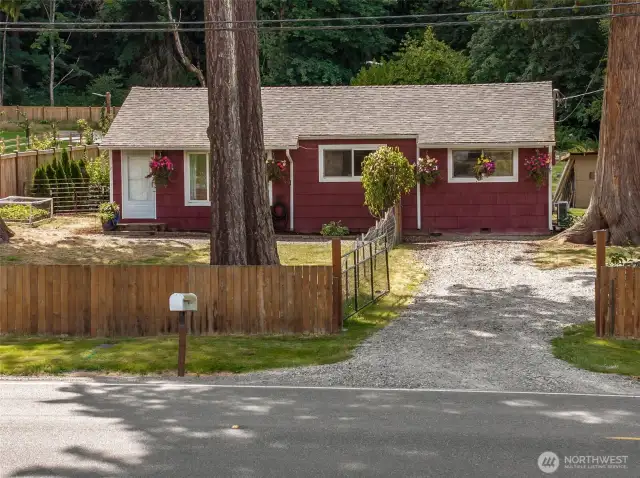 Nice fencing for privacy and to keep all the farm friends in. Manual gate seen here. This home has a country feel yet is only a couple minutes away from all the amenities you could need.